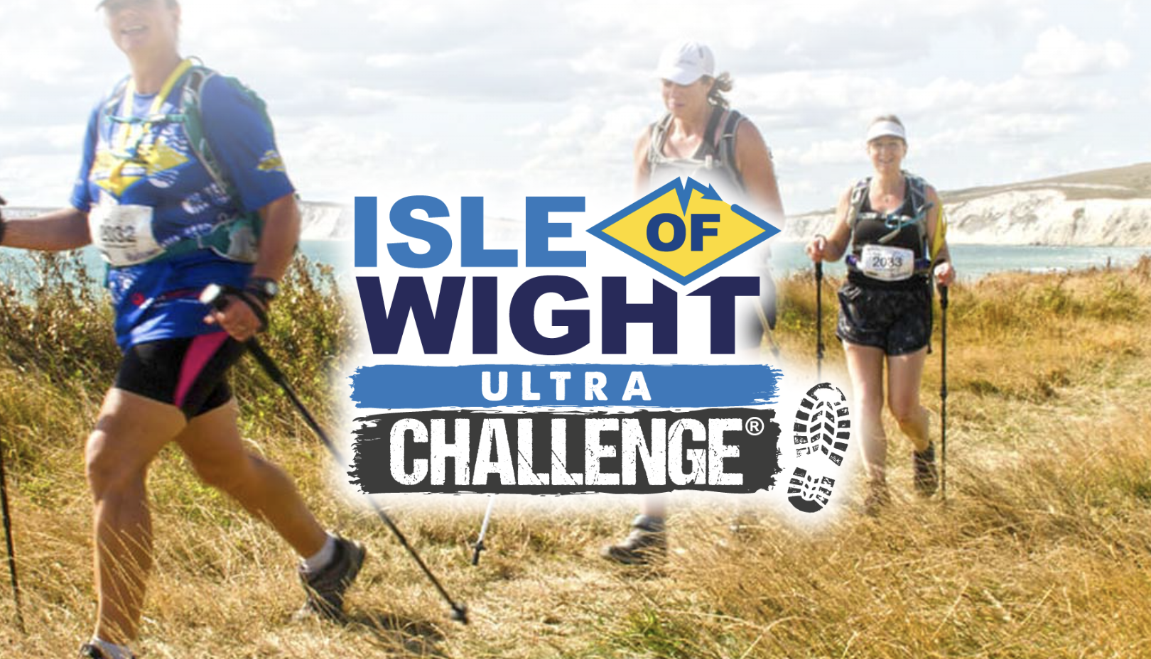 A promotional graphic for the "Isle of Wight Ultra Challenge," featuring bold text with a diamond-shaped logo highlighting "OF." The background depicts a sunny coastal trail with smiling participants hiking through grassy terrain, equipped with trekking poles and backpacks. The scenic cliffs and sea in the distance add to the sense of adventure. Boot print graphics at the bottom of the logo emphasise the active, outdoor nature of the challenge.